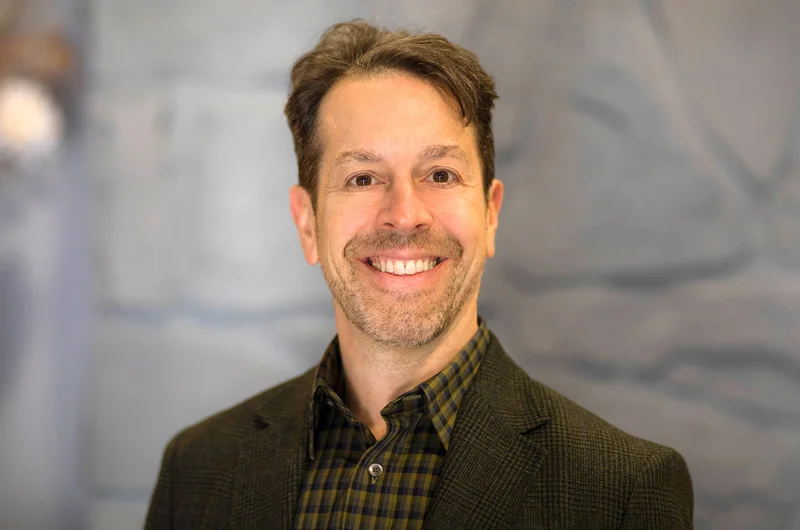 man smiling in a brown sport coat and shirt against a stone wall Alumnus and Trustee Michael E. Bugno to Chair Marywood’s Flagship Annual Fundraiser Celebrate Marywood